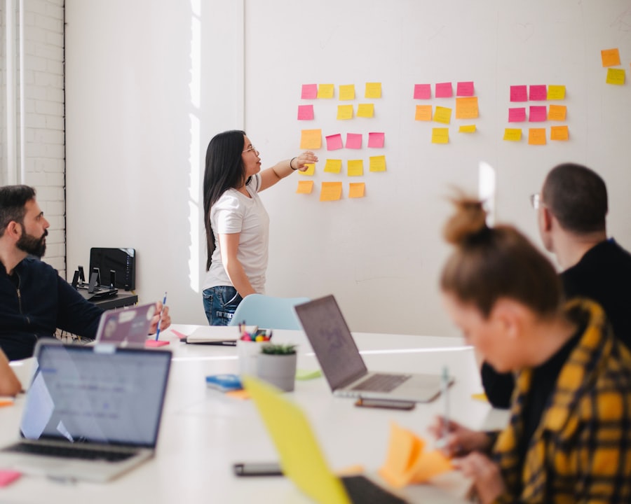 Business team collaborating over laptops and documents in an office