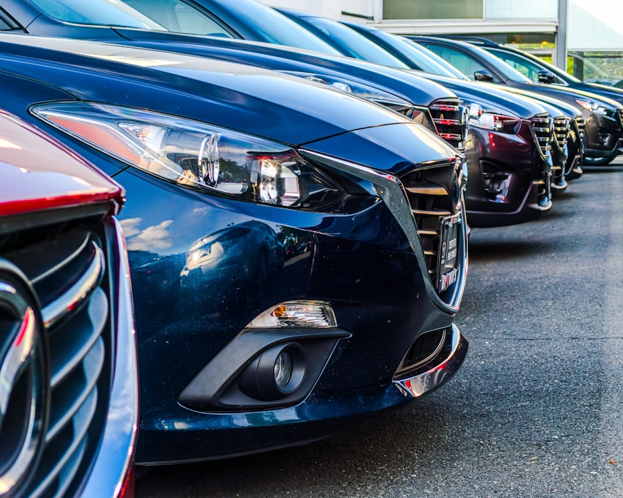 A row of new cars lined up on a forecourt