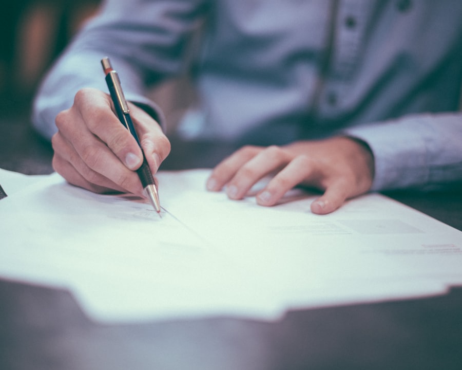 Tender documentation being reviewed and completed at a desk